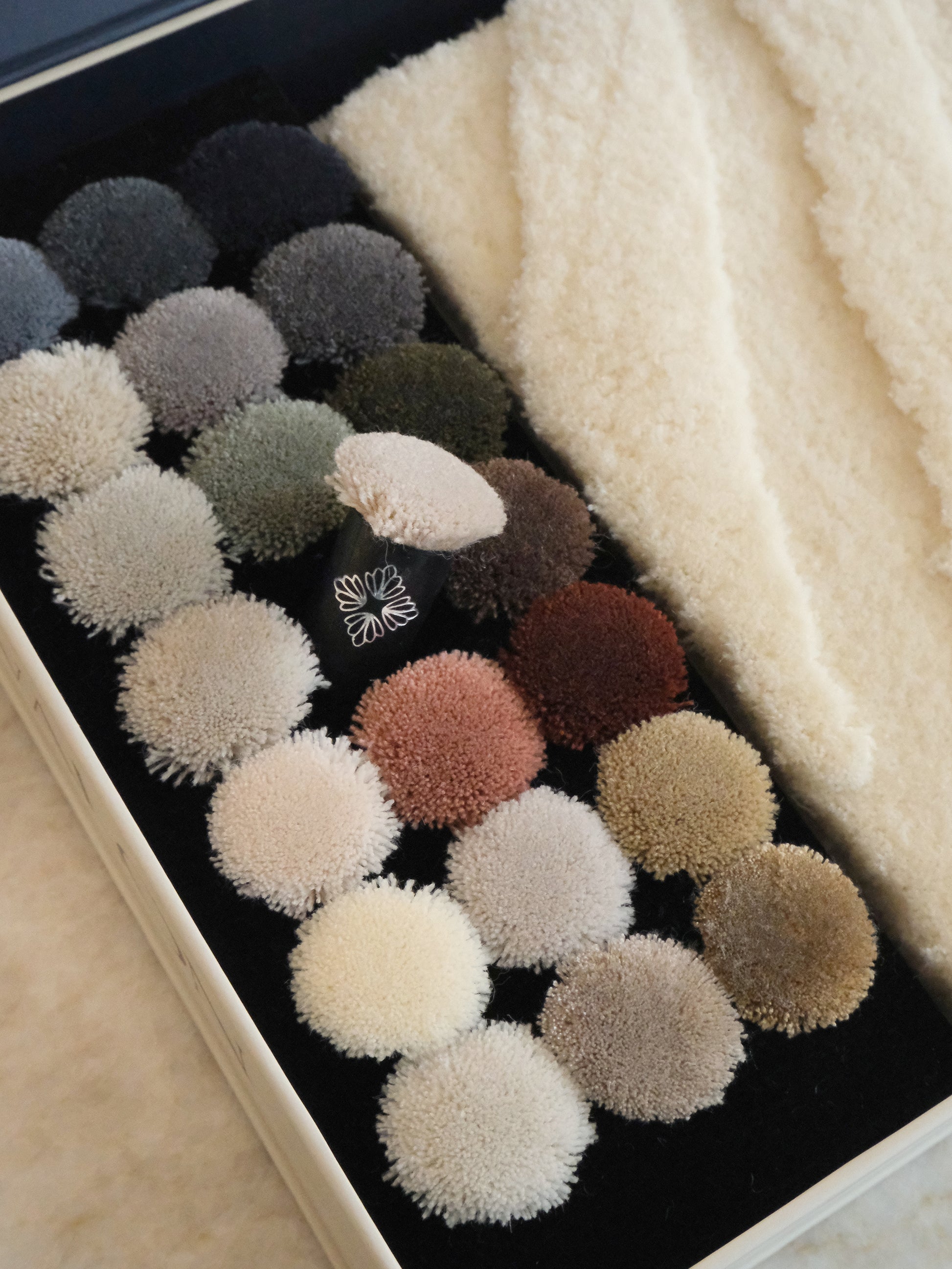 21 custom coloured poms to pick any combination of custom colour for your Avalon by Loomah bespoke rug